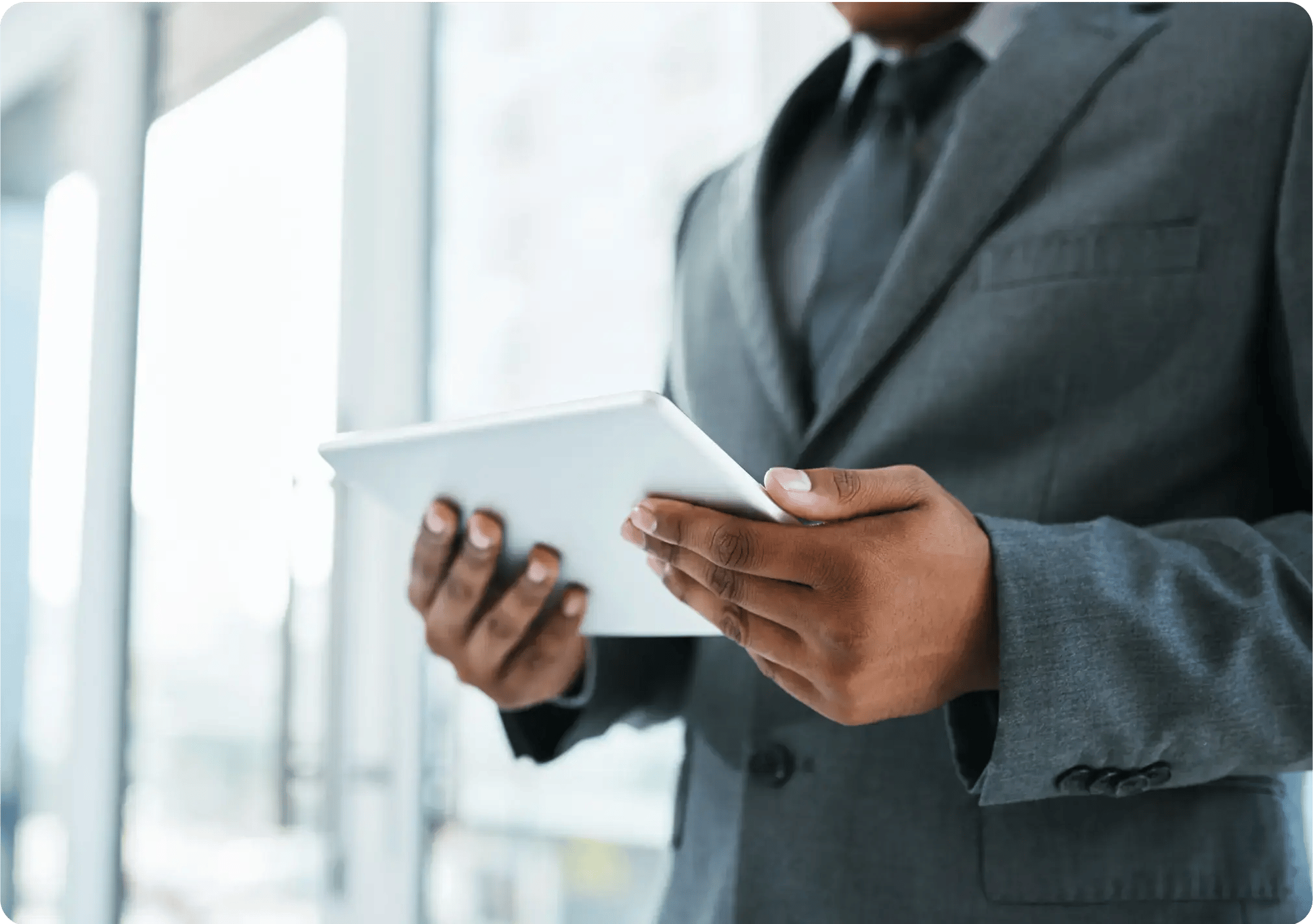 shot-of-a-businessman-using-a-digital-tablet-in-a-2023-11-27-04-54-25-utc 1